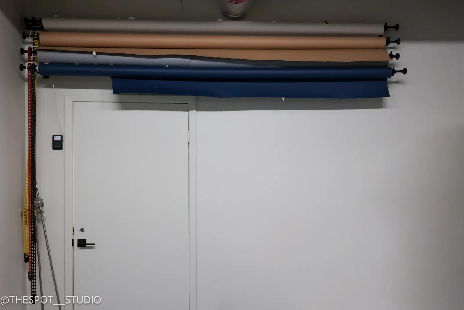 Backdrop color rolls mounted in the Garage Room
