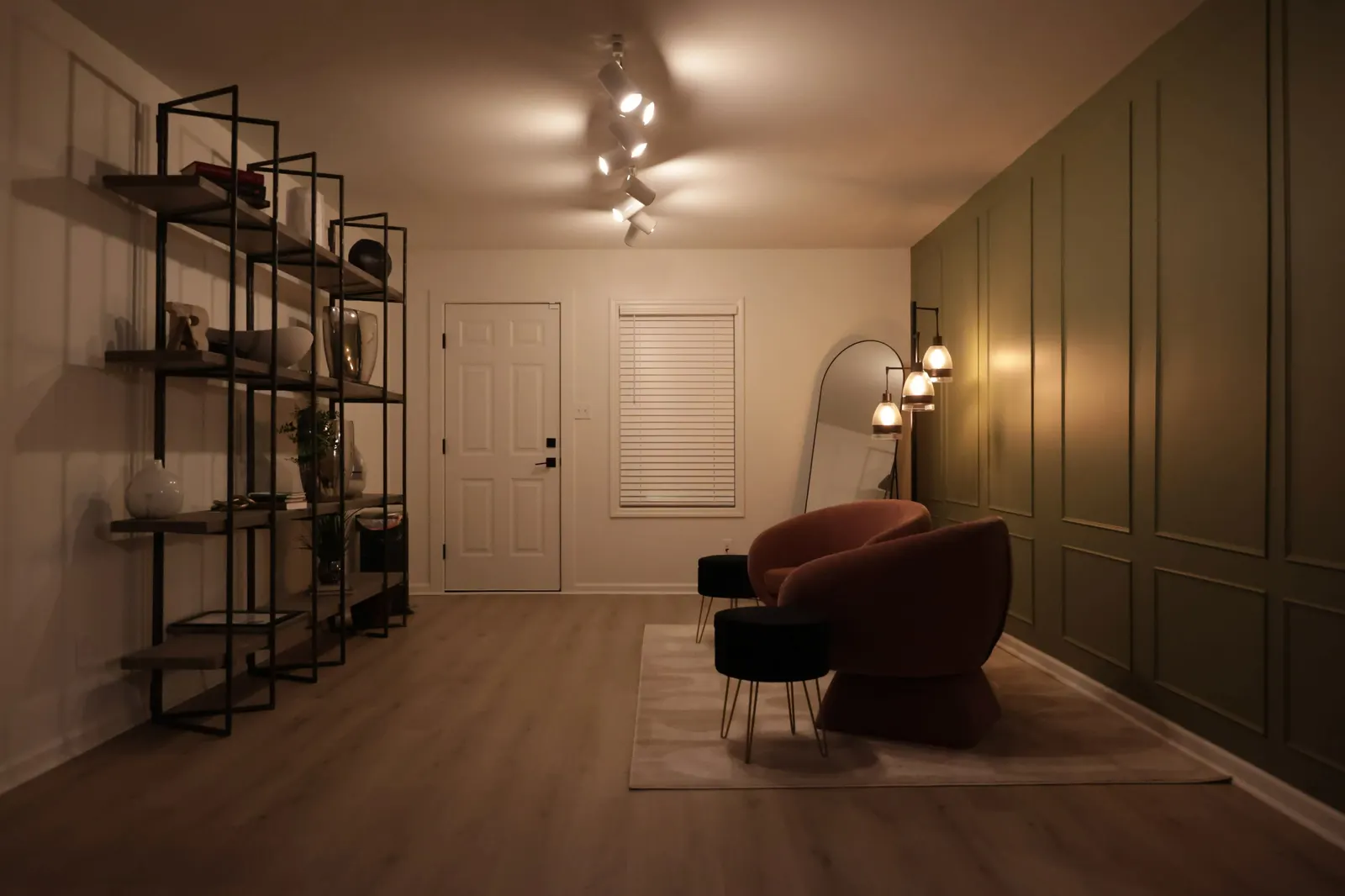 The Spot Primary Studio with green wall and lounge seating